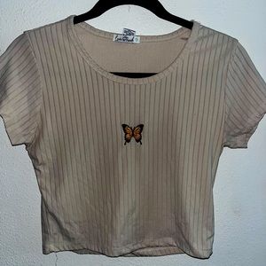Cream crop top with butterfly in the front